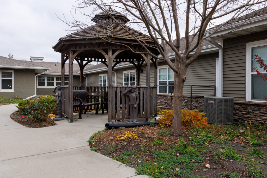 Gazebo and outdoor courtyard at Westhaven Community in Boone, Iowa with bench seating, walking path, and landscaped grounds.