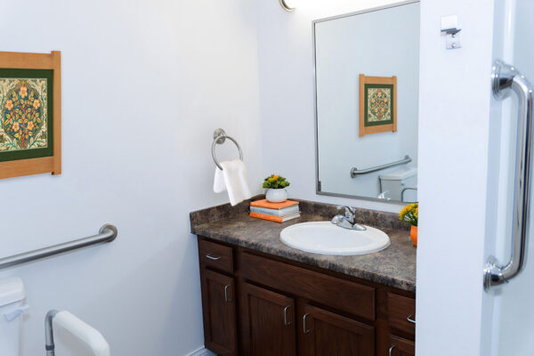 Private bathroom in an independent living apartment at Westhaven in Boone, Iowa with walk-in shower, grab bars, vanity, and accessible design features.