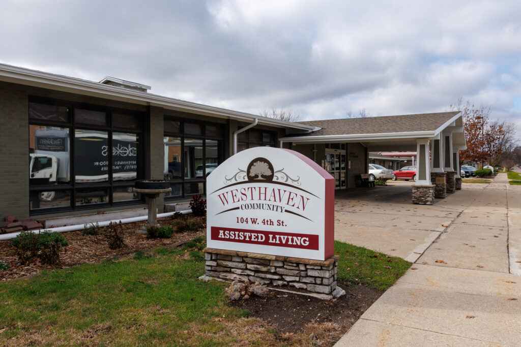 Westhaven Community assisted living entrance sign in Boone, Iowa with building exterior, covered entry, and parking area.