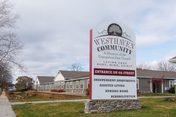 Westhaven Community sign and campus exterior in Boone, Iowa, showing long-term care, assisted living, independent apartments, and rehabilitation services.